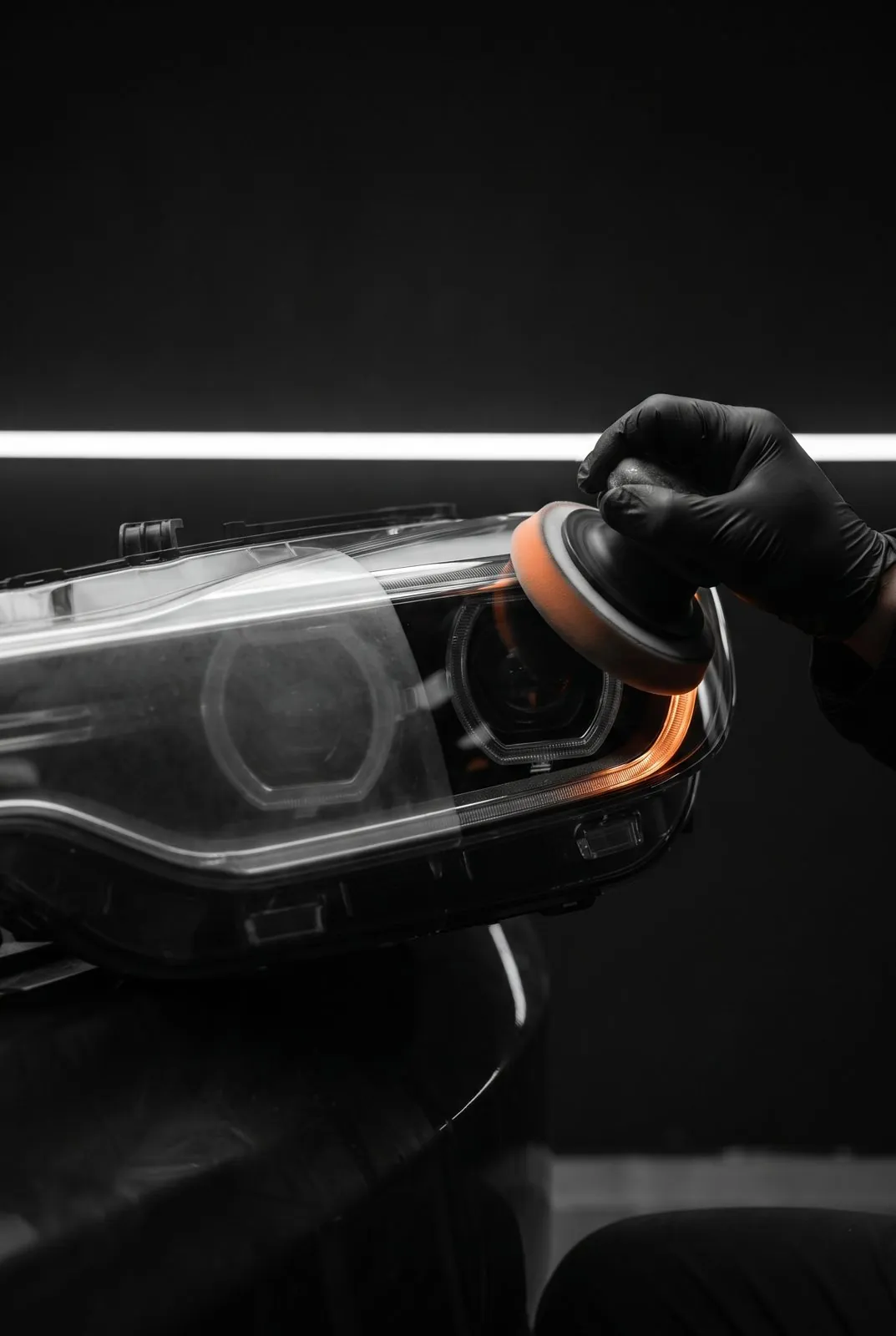 Polishing a headlight lens